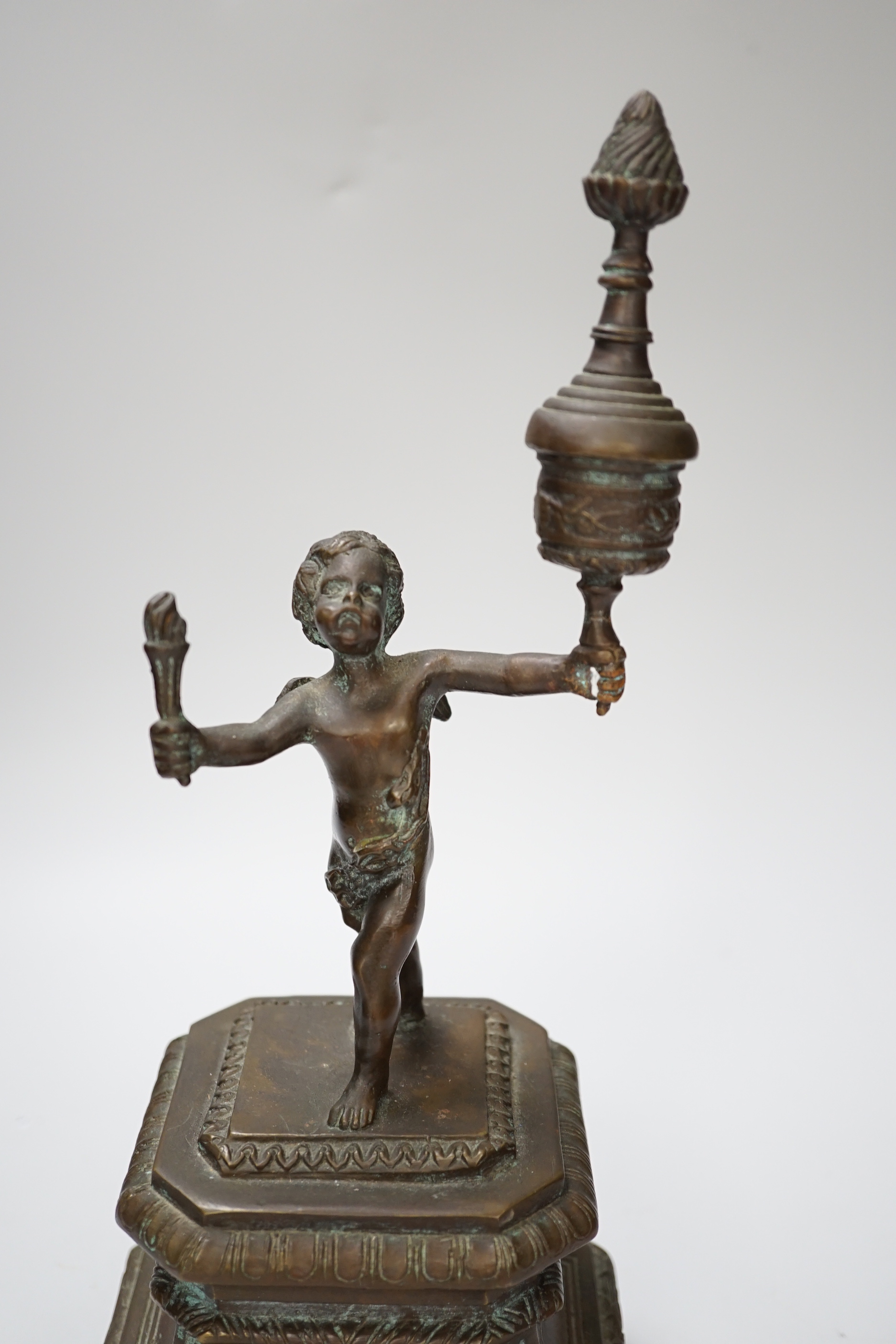 A bronze figure of a cherub, 30cm